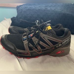 Salomon speed cross various. Black and grey with red accent color.